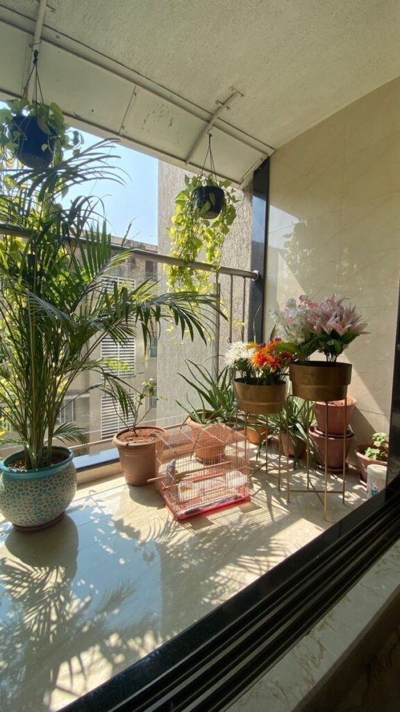 Creative urban balcony garden setup with railing planters, vertical shelves, and low-maintenance indoor plants perfect for compact spaces.